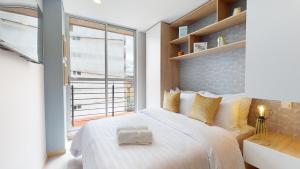 Letto o letti in una camera di The Cabrera Eighty Fifth Hotel