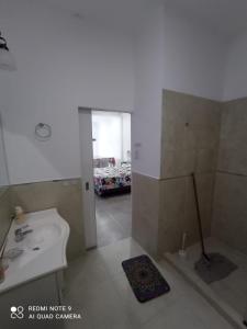 a bathroom with a sink and a toilet and a shower at Josefina l in Goya