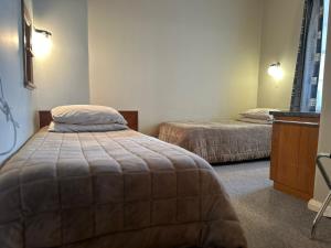 Postel nebo postele na pokoji v ubytování Merrylees Hotel + 30 fotografií