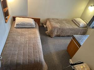 Postel nebo postele na pokoji v ubytování Merrylees Hotel