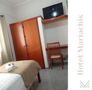 Voodi või voodid majutusasutuse Mariachis Hotel toas