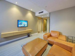 Телевізор і / або розважальний центр в Metropolo Hotel Jiangyin Hongqiao Road Baiye Plaza