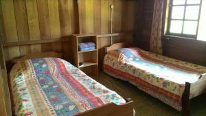 Postel nebo postele na pokoji v ubytování Labang Guesthouse Bario