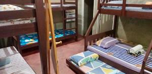 Gensan Hostel房間的床