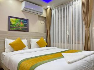 Ένα ή περισσότερα κρεβάτια σε δωμάτιο στο Hotel Aaradhya +121 φωτογραφίες