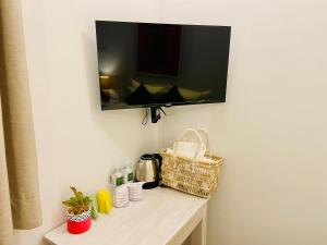 Příslušenství pro přípravu čaje a kávy v ubytování Ayur Ayur White Sail Villa