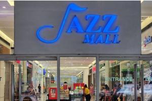 a mall with a sign on the front of it at Boho Beach Vibes 2br Apt 2 in Makati in Manila