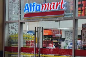 a store with an air mart sign in the window at Boho Beach Vibes 2br Apt 2 in Makati in Manila