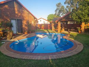 a swimming pool in the yard of a house at Cassiandra Place unit 3 in Richards Bay