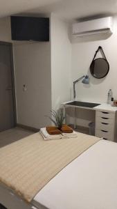 a room with a bed and a kitchen with a sink at Special Room Sofia's Happy House- Almodôvar Ourique - Room 3 in Aldeia dos Fernandes +38 photos