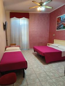 Postel nebo postele na pokoji v ubytování Hotel PRINCIPE AMEDEO