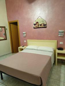 Postel nebo postele na pokoji v ubytování Hotel PRINCIPE AMEDEO