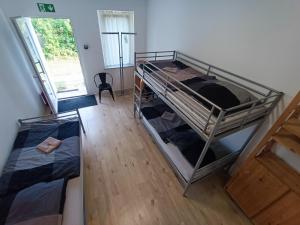 an overhead view of a room with two bunk beds at GranseeHOSTEL in Gransee