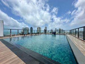a swimming pool on the roof of a building at Pendennis Fern - 4-Bedroom Luxury Retreat with Rooftop Pool in Central Colombo in Colombo