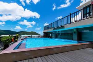 a swimming pool on the balcony of a building at Tuấn Ninh Hotel II in Con Dao