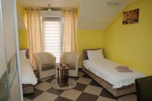 Ένα ή περισσότερα κρεβάτια σε δωμάτιο στο Apartmani Ad fines