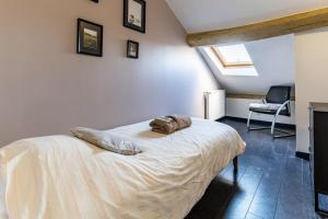 En eller flere senge i et værelse på Le Liberté Coeur de ville Duplex