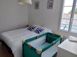 Postel nebo postele na pokoji v ubytování Les goélands