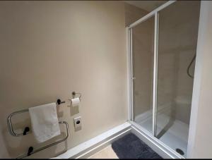 a shower in a bathroom with a glass shower stall at Charming 2-Bedrooms City Centre Apartment-No Party in Aberdeen