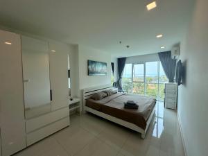 Ένα ή περισσότερα κρεβάτια σε δωμάτιο στο One Tower 1 Bed 84 by ThaiminatorPattaya +10 φωτογραφίες