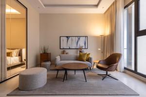 a living room with a couch and a table at Rafa- Hittin in Riyadh