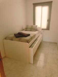 Ένα ή περισσότερα κρεβάτια σε δωμάτιο στο Apartamento Marlayo +15 φωτογραφίες