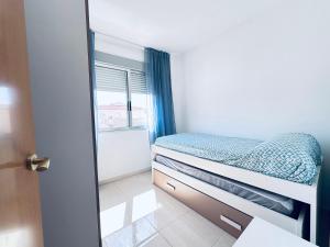 Katil atau katil-katil dalam bilik di Apartamento Familiar a 1 Min del Mar