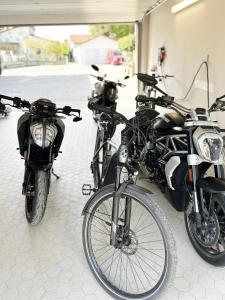 a group of motorcycles parked in a garage at Hotel-Restaurant Gasthaus Bonimeier in Niedergottsau