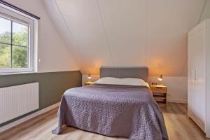 Postel nebo postele na pokoji v ubytování Heemhoeve Lodge