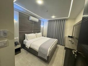 Postel nebo postele na pokoji v ubytování Golden Light Aqaba Hotel فندق جولدن لايت العقبة