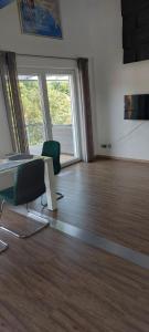 an empty room with a bed and a table and chairs at Elaine in Schongau