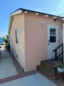 a house with a porch and a door at The Hub in Del Aire