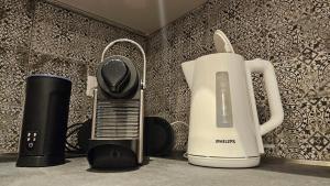 Příslušenství pro přípravu čaje a kávy v ubytování Loft Delle Scalette
