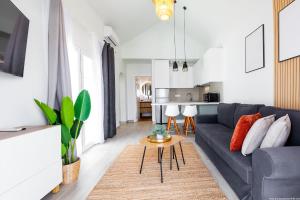 a living room with a couch and a table at Spacious apartment with ocean view in Adeje