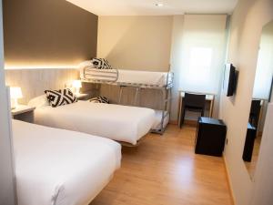 Postel nebo postele na pokoji v ubytování Hotel Restaurante Cadosa