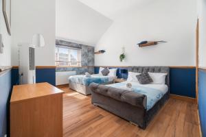 a living room with a couch and a bed at Detached 3BR house in Ashford with Free Parking in Ashford