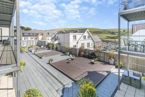an aerial view of a patio on a house at 6 Putsborough - Luxury Apartment at Byron Woolacombe, only 4 minute walk to Woolacombe Beach! in Woolacombe
