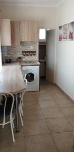 Kuchyňa alebo kuchynka v ubytovaní Joe Beach Apartman