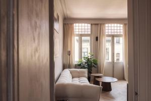 Area soggiorno di Zurenborg Suites