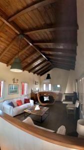 a living room with a couch and a table at Stone Villa Maria in Galaxidhion +132 photos
