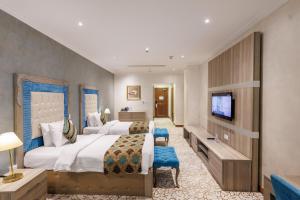 En eller flere senger på et rom på Sapphire Plaza Hotel
