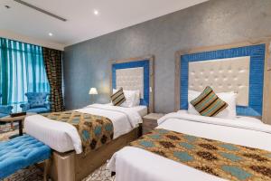 En eller flere senger på et rom på Sapphire Plaza Hotel