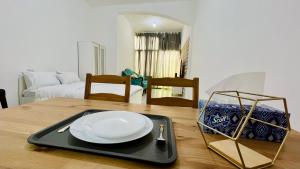 a plate on a tray on top of a table at AD Villa Studio in Abu Dhabi