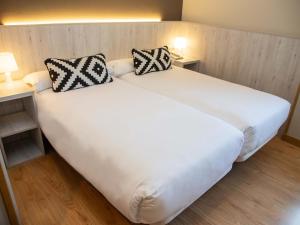 Postel nebo postele na pokoji v ubytování Hotel Restaurante Cadosa