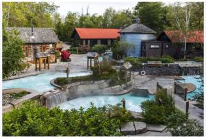 a backyard with a swimming pool and a house at Studio Condo @ North Creek|Pool/Hot Tub/Crave TV in Blue Mountains