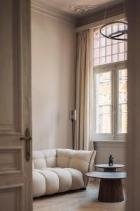 Area soggiorno di Zurenborg Suites