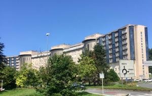 a large building with a sign in front of it at DonostiNest in Donostia-San Sebastián