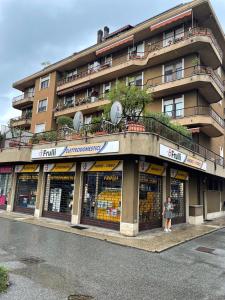 a woman standing in front of a building at Casa Maira in Luino