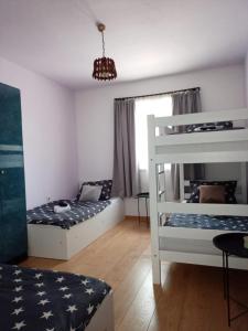 a room with two beds and a bunk bed at Apartman Dane i Ivana Međugorje in Međugorje