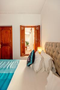 Postel nebo postele na pokoji v ubytování Riad Luciano Hotel and Spa